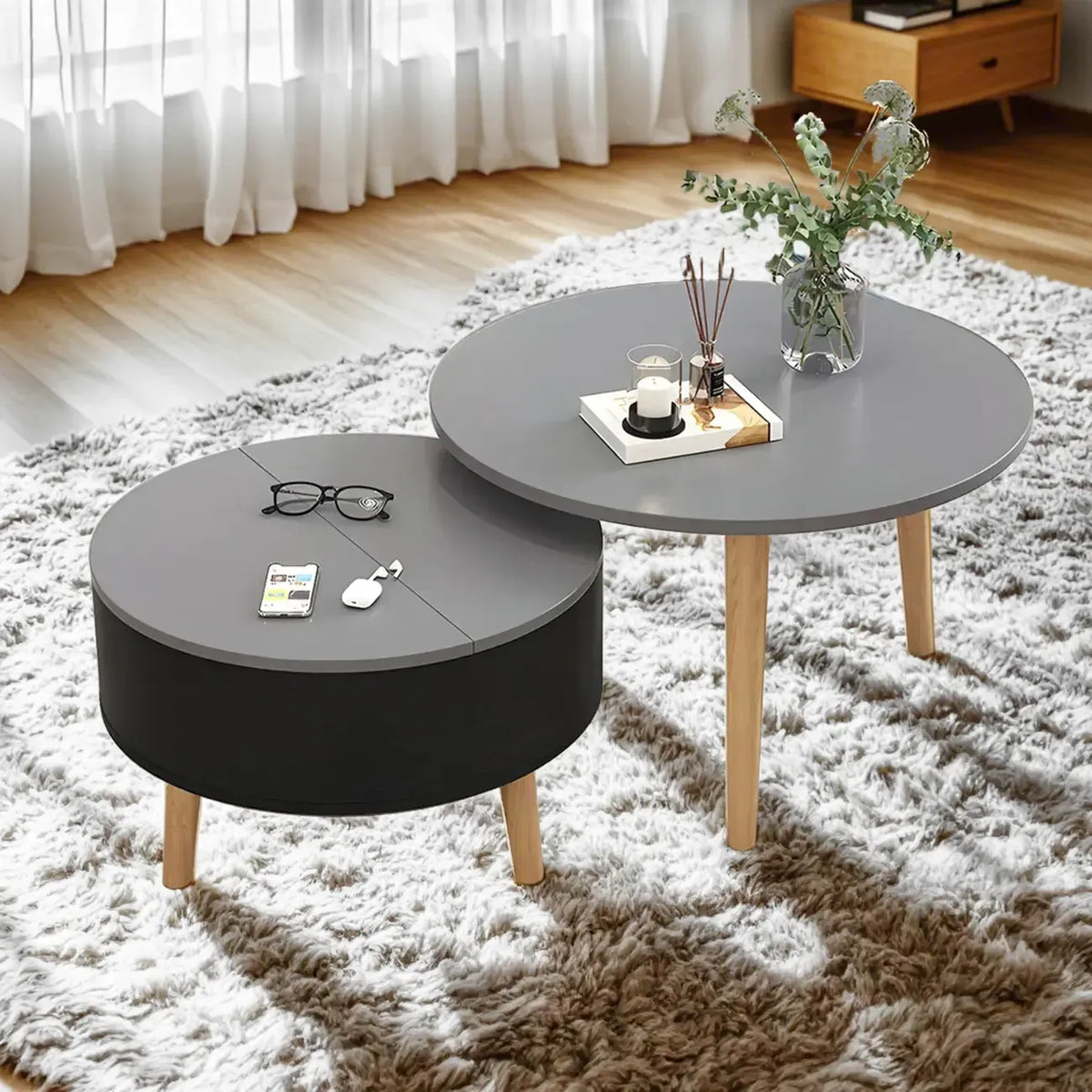 Moderne ronde houten salontafel in zwart en wit met opbergruimte